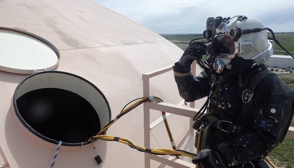 Commercial Diver Entering Pink Water Reservoir